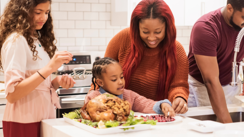 Family of 4 preparing dinner